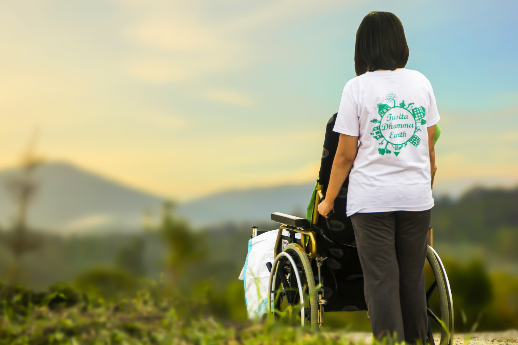 Nurse Caring for an Elder in Wheelchair
